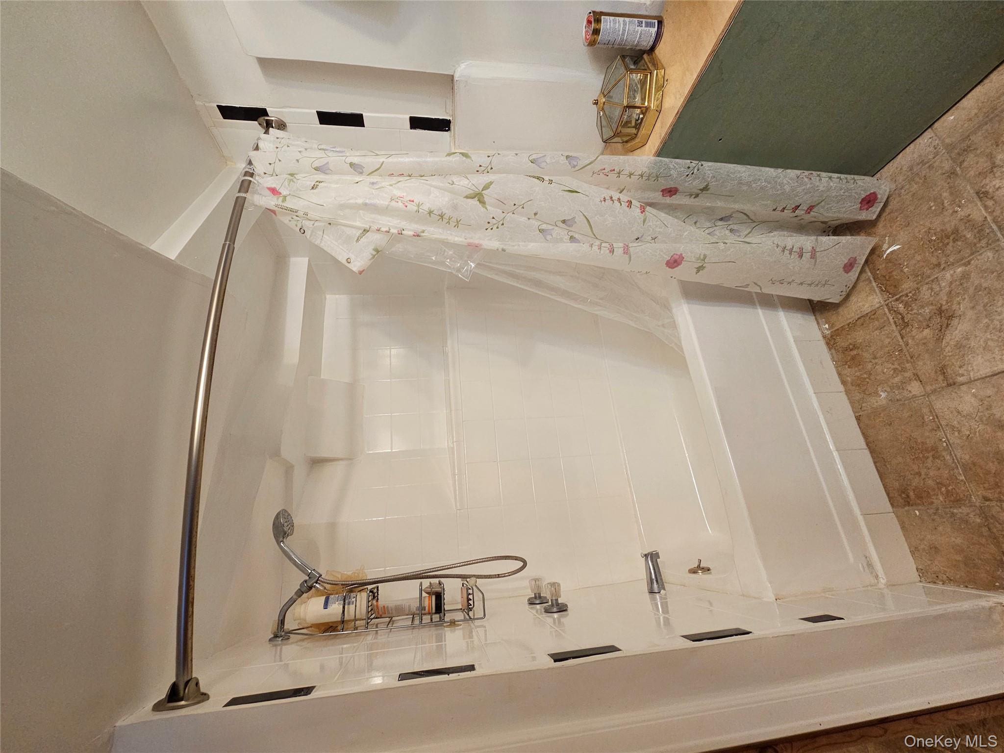 88 Innis Avenue Poughkeepsie, NY 12601 - Photo 21 of 33 a bathroom with a shower and a tub