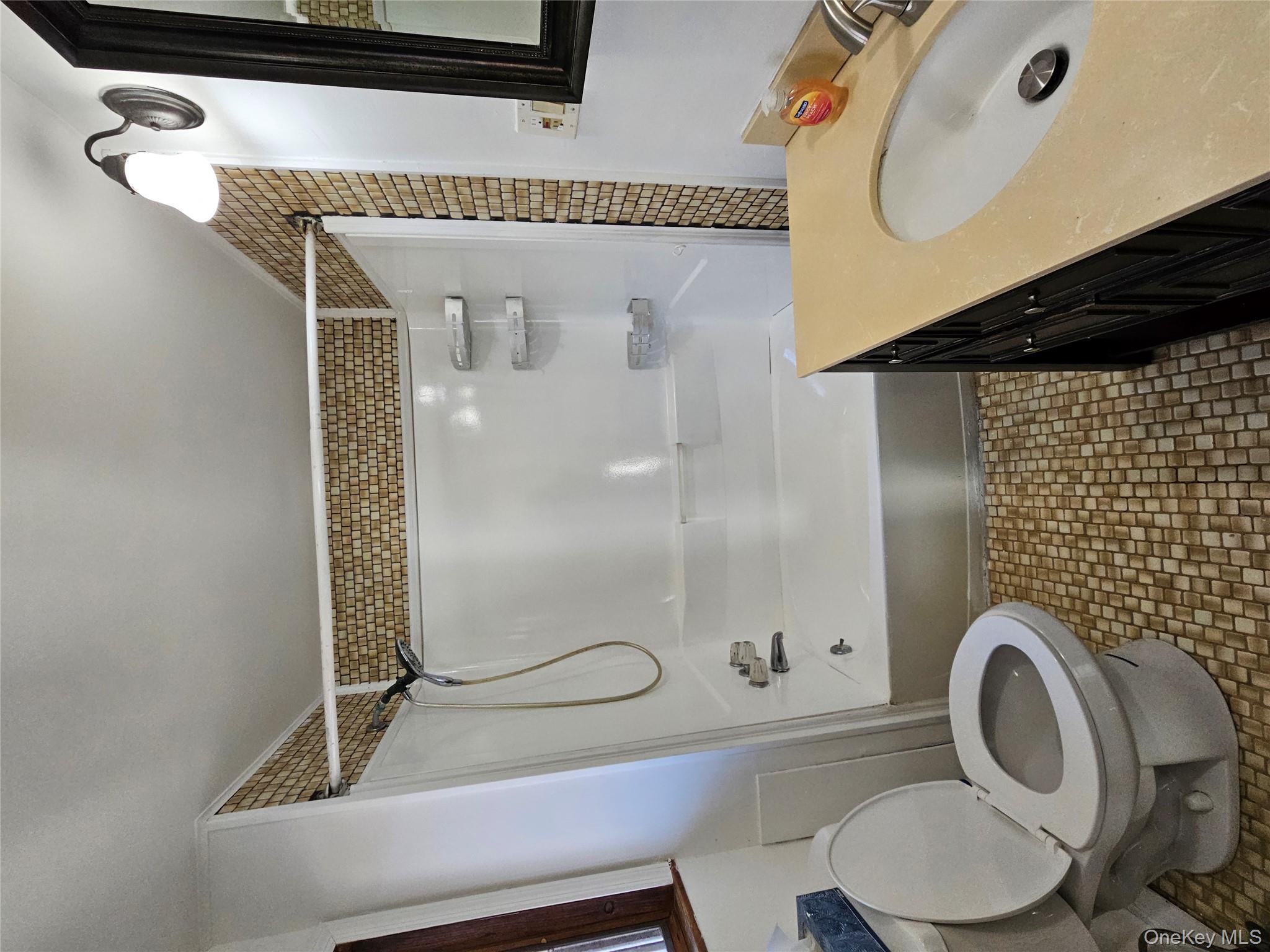 88 Innis Avenue Poughkeepsie, NY 12601 - Photo 28 of 33 a bathroom with a sink toilet and shower