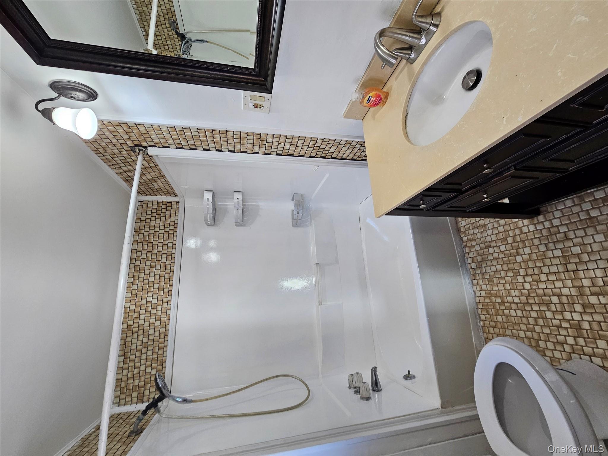 88 Innis Avenue Poughkeepsie, NY 12601 - Photo 29 of 33 a bathroom with a sink a toilet and shower