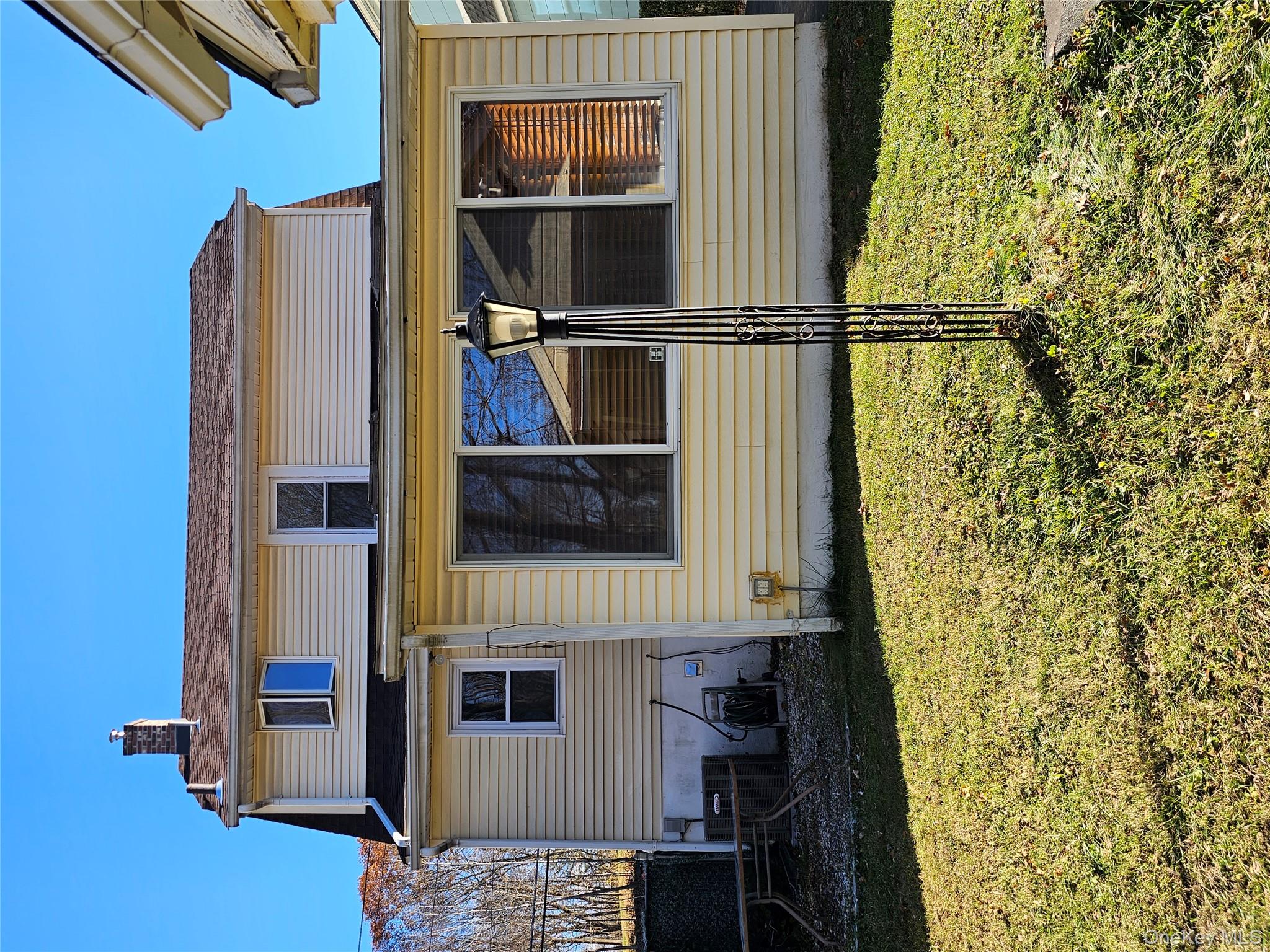 88 Innis Avenue Poughkeepsie, NY 12601 - Photo 8 of 33 a view of a house with a yard