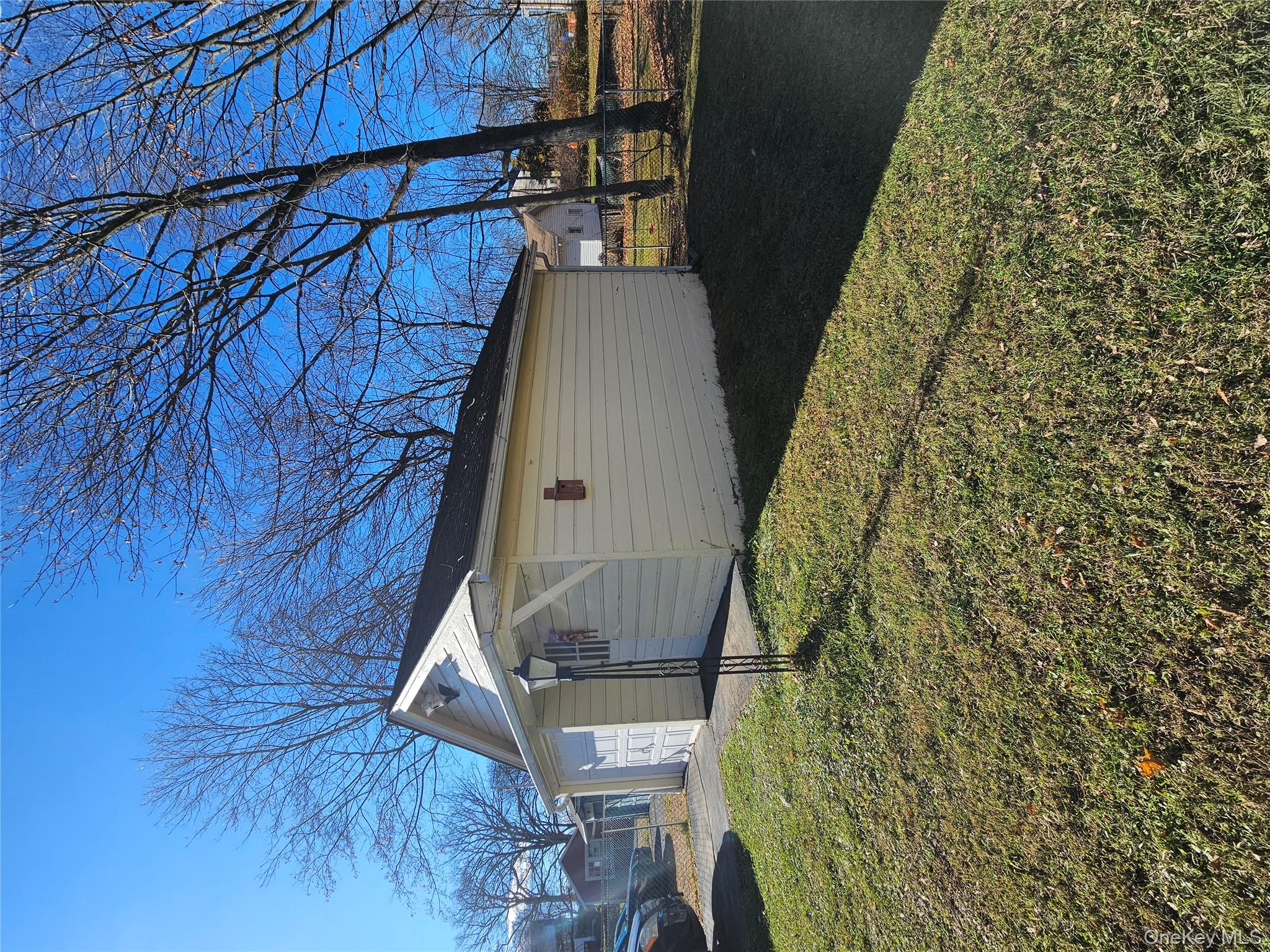 88 Innis Avenue Poughkeepsie, NY 12601 - Photo 9 of 33 a backyard of a house with lots of green space