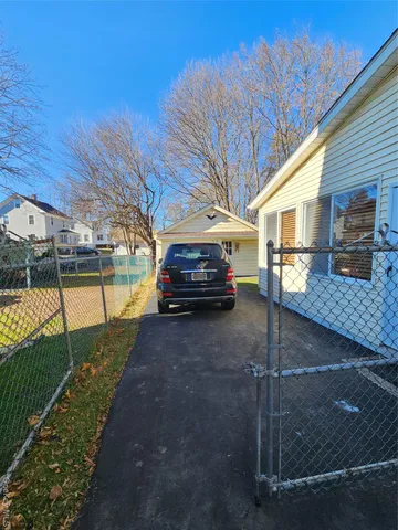 a car parked in front of a house