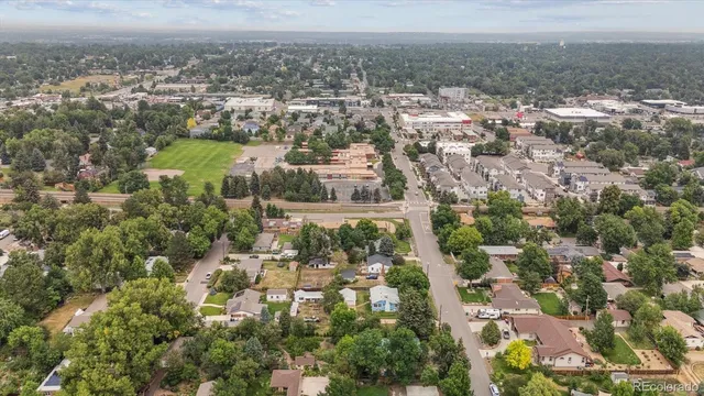 an aerial view of residential building and trees around