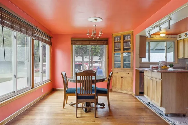 a view of a dining room with furniture window and wooden floor