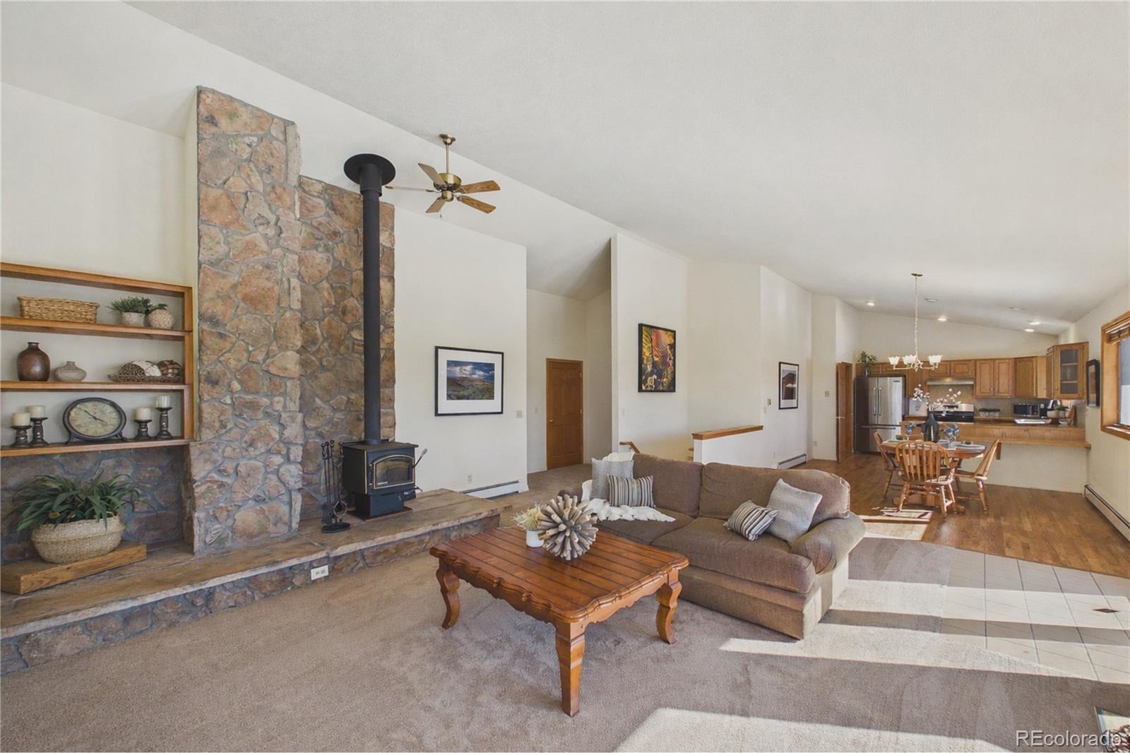 10798 Crystal Way Morrison, CO 80465 - Photo 4 of 36 a living room with furniture and a table