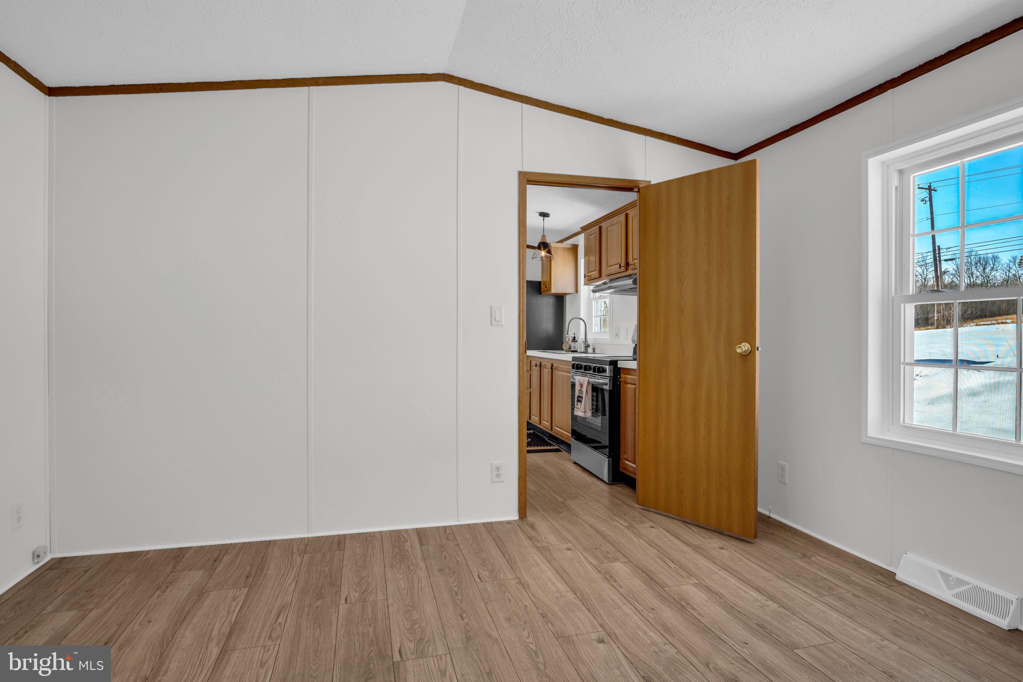 821 Windy Hill Road Shermans Dale, PA 17090 - Photo 11 of 30 a view of empty room with wooden floor and closet