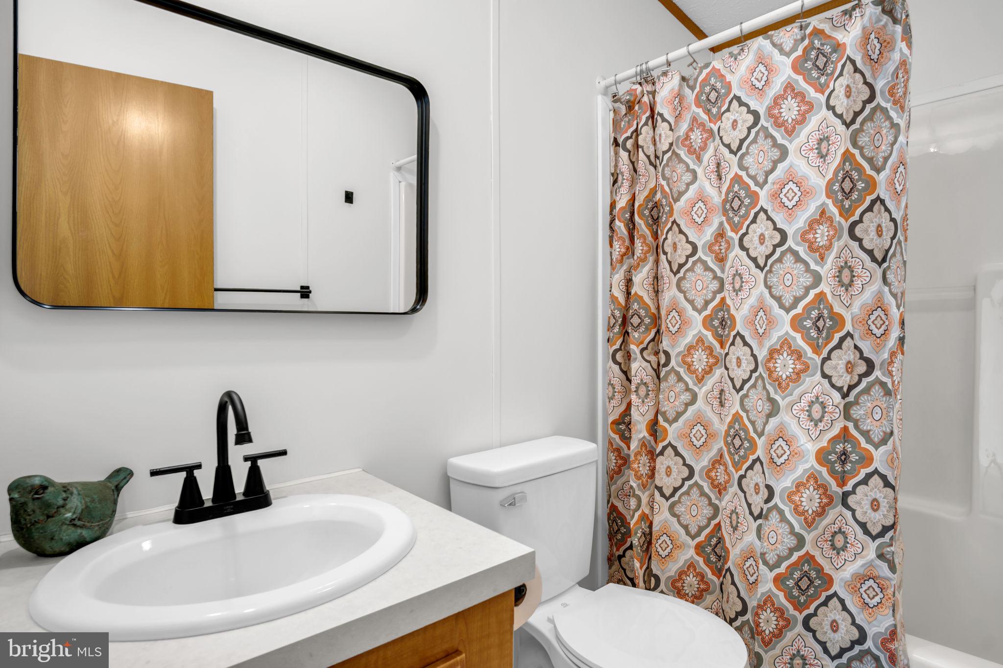 821 Windy Hill Road Shermans Dale, PA 17090 - Photo 13 of 30 a bathroom with a sink and a mirror