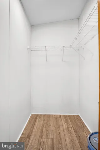 a view of a room with wooden floor