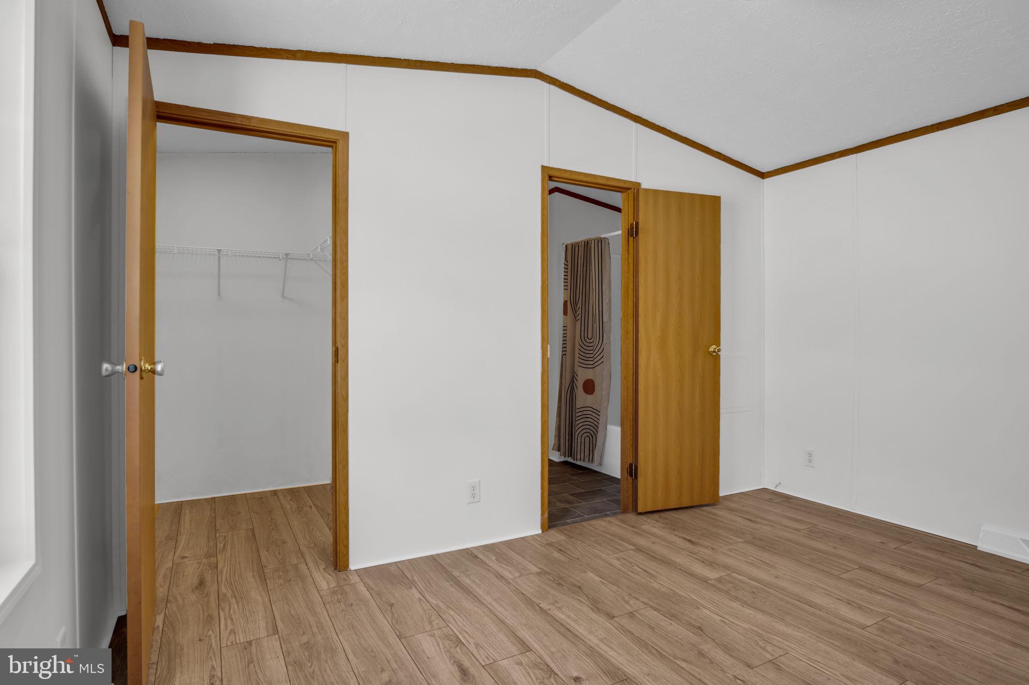 821 Windy Hill Road Shermans Dale, PA 17090 - Photo 21 of 30 a view of an empty room with wooden floor and a window