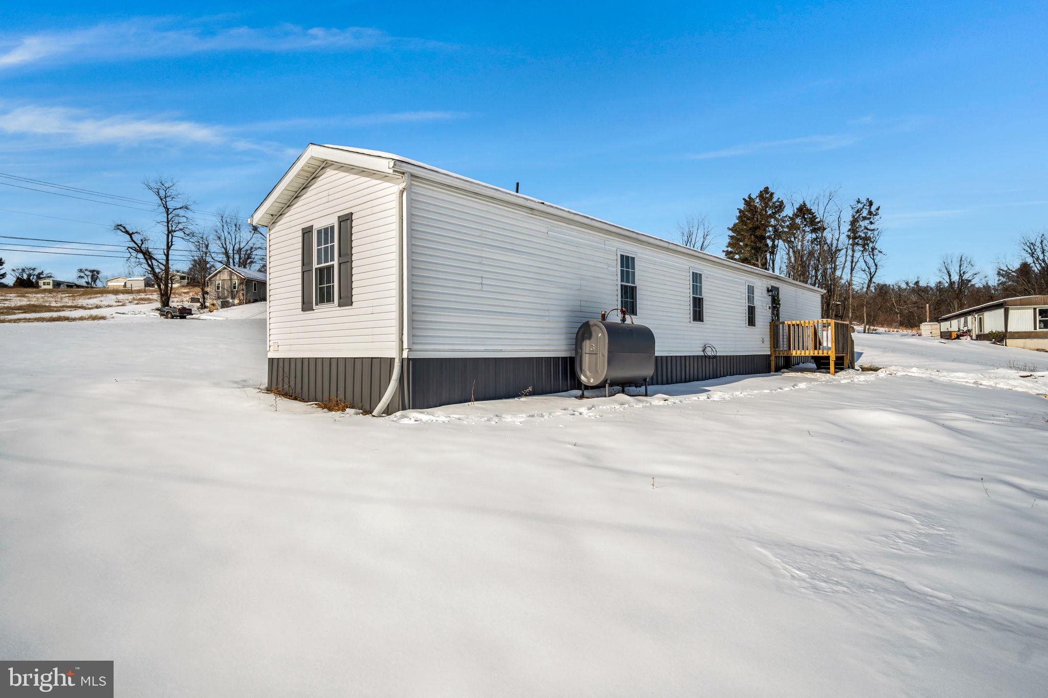 821 Windy Hill Road Shermans Dale, PA 17090 - Photo 27 of 30 a view of a house with a snow in the background