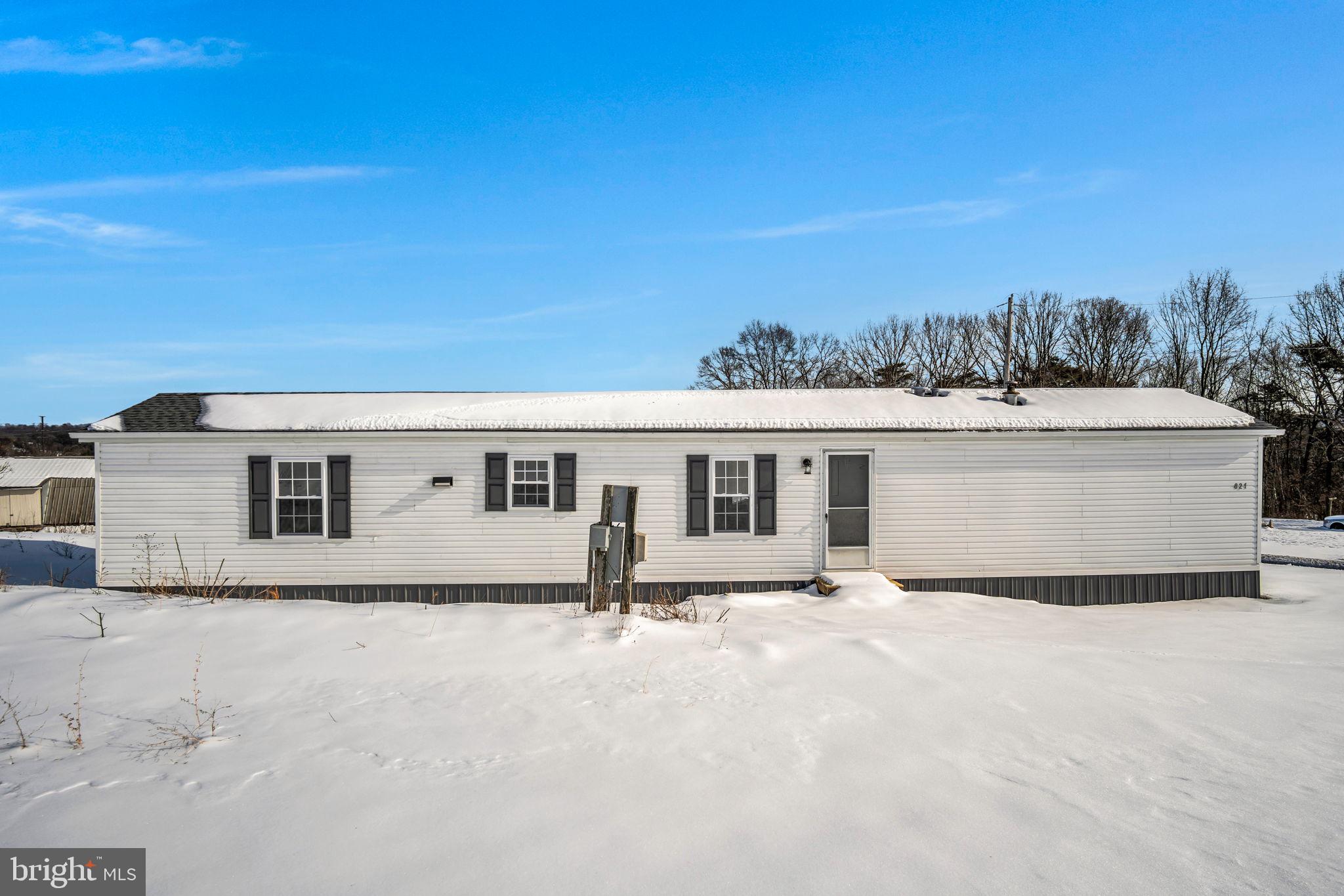821 Windy Hill Road Shermans Dale, PA 17090 - Photo 28 of 30 a white house with a yard and wooden fence