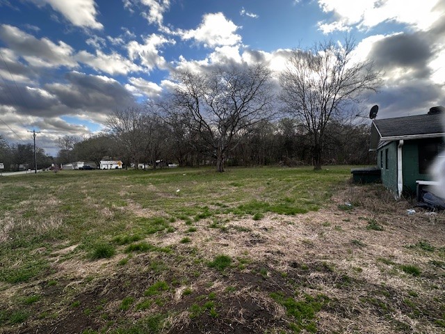 3702 Highway 49 Tennessee Ridge, TN 37178 - Photo 2 of 10 a view of outdoor space with deck and yard