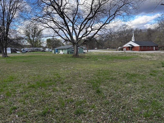 3702 Highway 49 Tennessee Ridge, TN 37178 - Photo 4 of 10 a front view of a house with a yard and trees