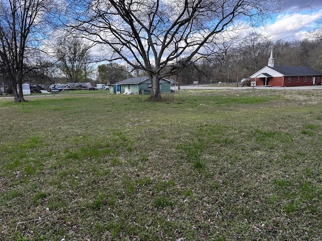 3702 Highway 49 Tennessee Ridge, TN 37178 - Photo 5 of 10 a view of a tree in front of a house