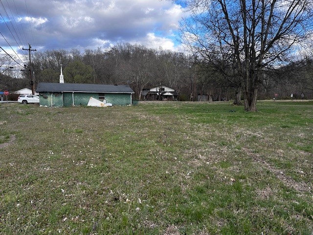 3702 Highway 49 Tennessee Ridge, TN 37178 - Photo 9 of 10 a view of a house with a yard