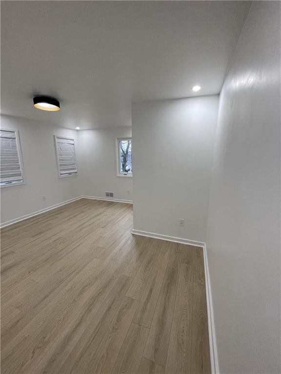 107 Shoup Street, Unit 2 Pittsburgh, PA 15209 - Photo 18 of 40 an empty room with wooden floor and windows
