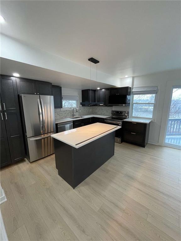 107 Shoup Street, Unit 2 Pittsburgh, PA 15209 - Photo 26 of 40 a large kitchen with stainless steel appliances kitchen island a large counter top and a sink