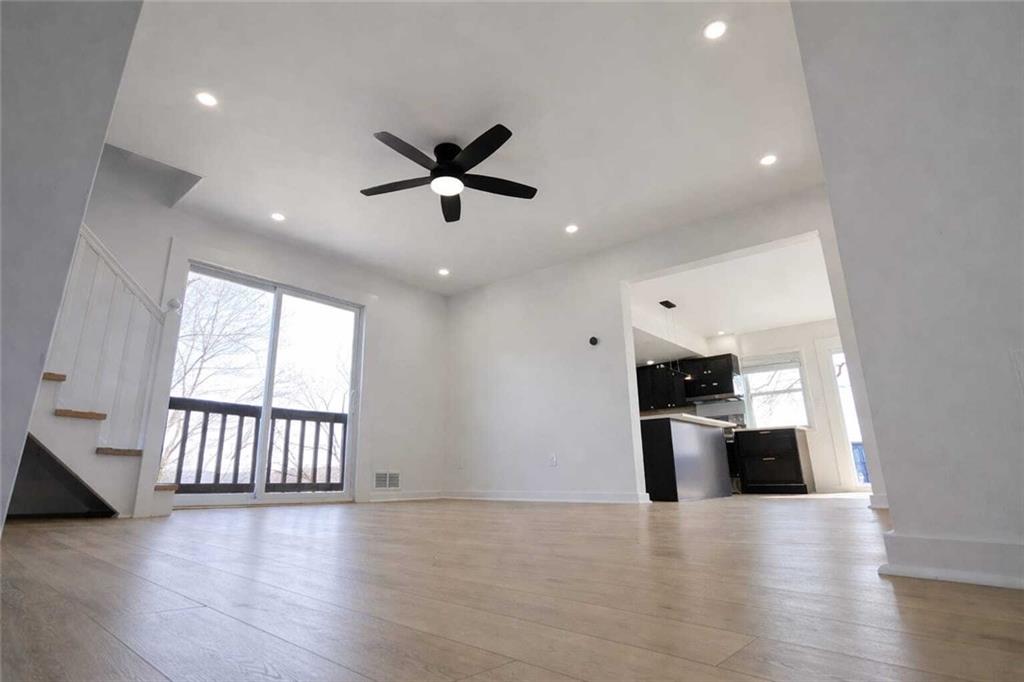 107 Shoup Street, Unit 2 Pittsburgh, PA 15209 - Photo 8 of 40 an empty room with wooden floor and windows