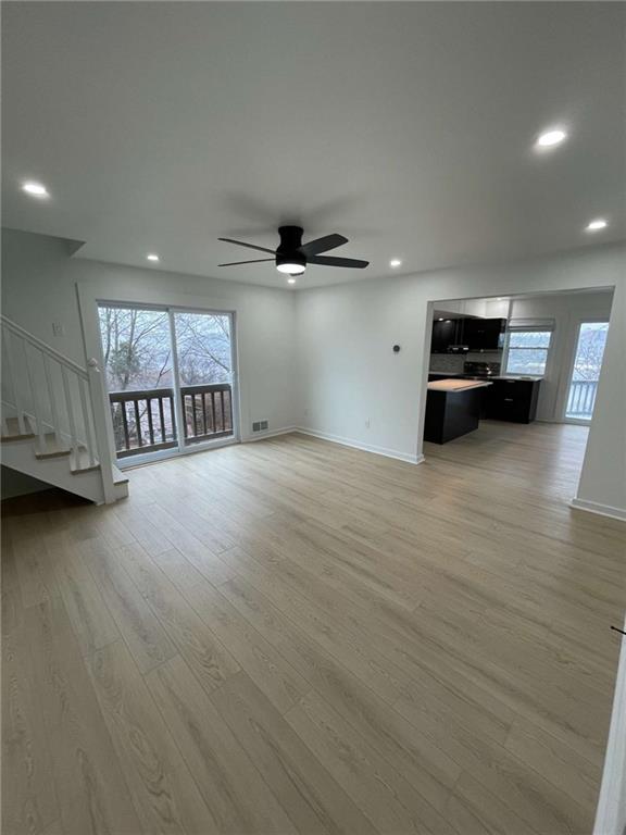 107 Shoup Street, Unit 2 Pittsburgh, PA 15209 - Photo 10 of 40 an empty room with wooden floor and windows