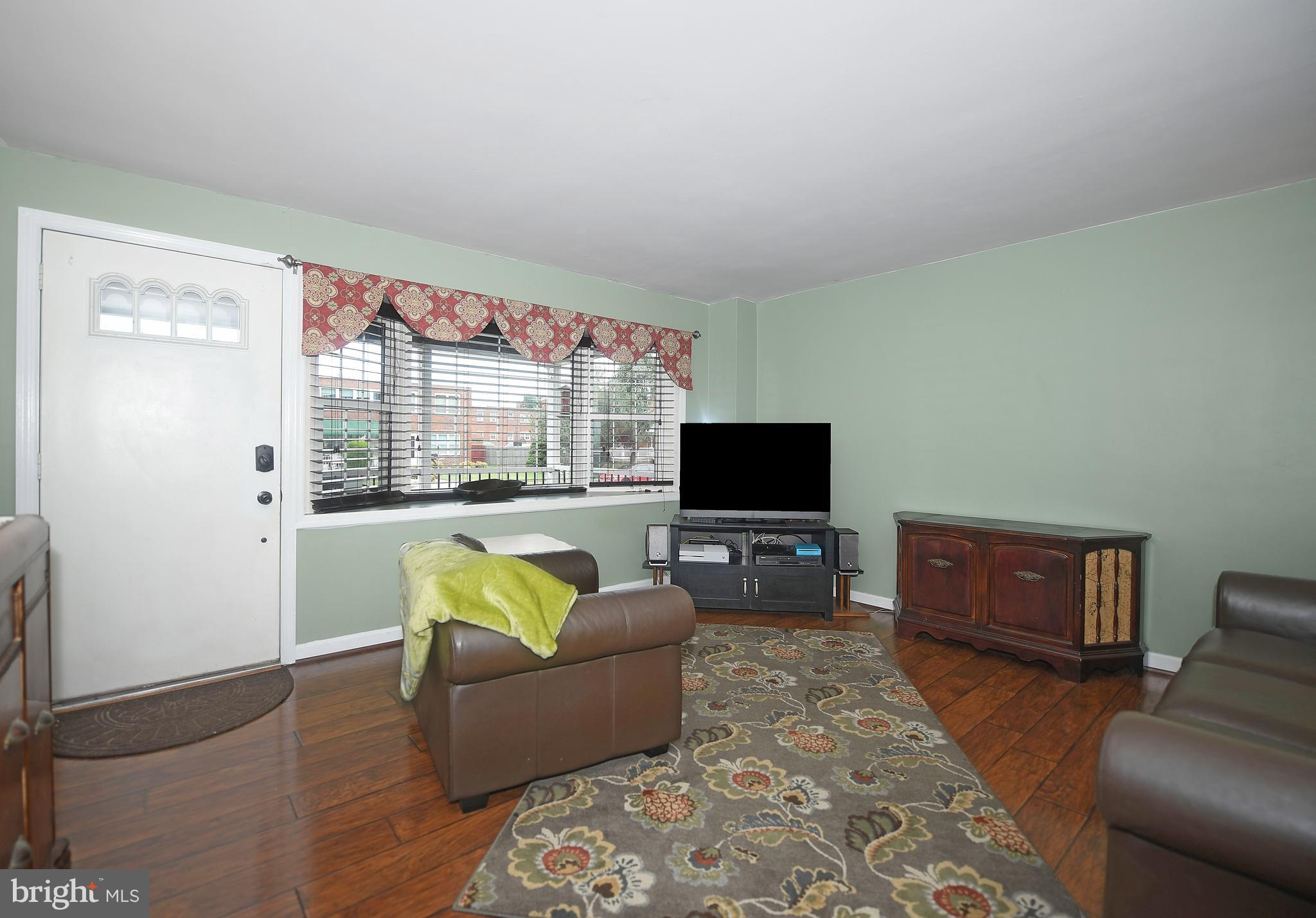 8109 Mid Haven Road Baltimore, MD 21222 - Photo 8 of 29 Laminate hardwoods stretch through main level!