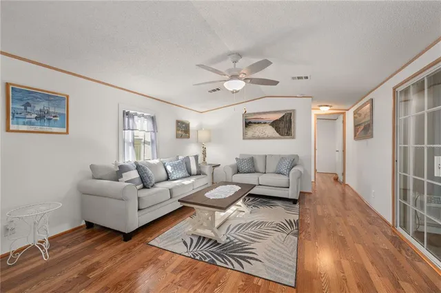 a bathroom with a granite countertop shower sink vanity and a mirror
