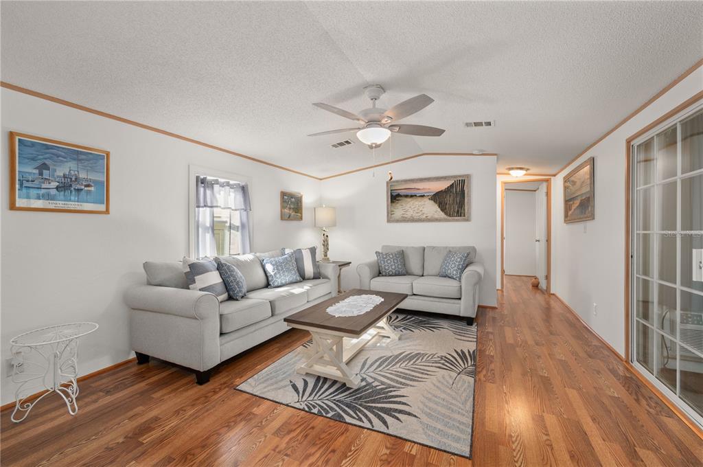 24437 Harbor View Road, Unit 114 Punta Gorda, FL 33980 - Photo 13 of 56 a living room with furniture and a window