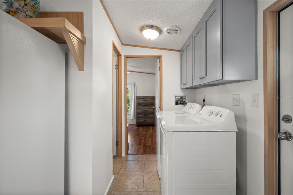 24437 Harbor View Road, Unit 114 Punta Gorda, FL 33980 - Photo 18 of 55 a utility room with dryer and washer
