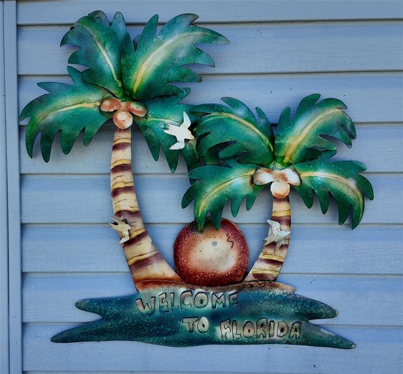 24437 Harbor View Road, Unit 114 Punta Gorda, FL 33980 - Photo 2 of 56 a vase of flowers sitting on a table