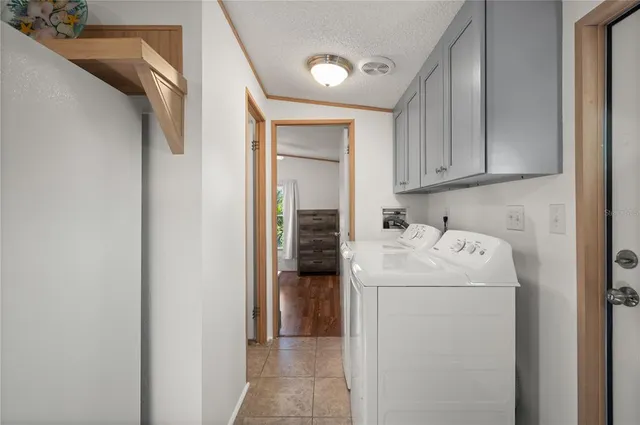 an aerial view of a house with a yard basket ball court and outdoor seating