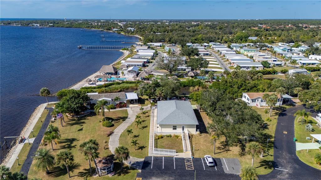 24437 Harbor View Road, Unit 114 Punta Gorda, FL 33980 - Photo 48 of 55 an aerial view of a house with a yard basket ball court and outdoor seating