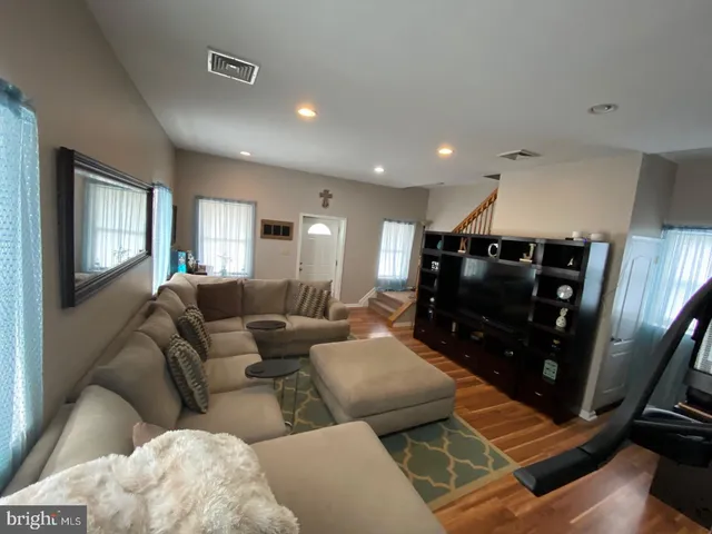 a kitchen with stainless steel appliances a stove a sink and a refrigerator