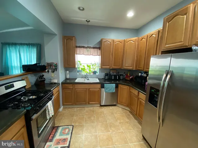 a bedroom with a bed and a tv