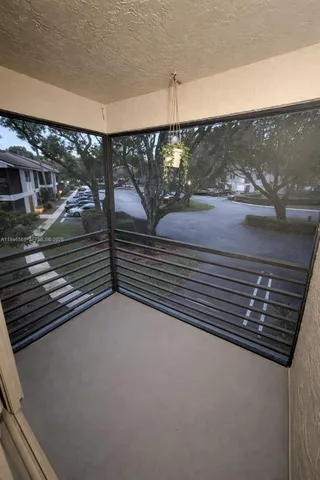 a view of a balcony with a street