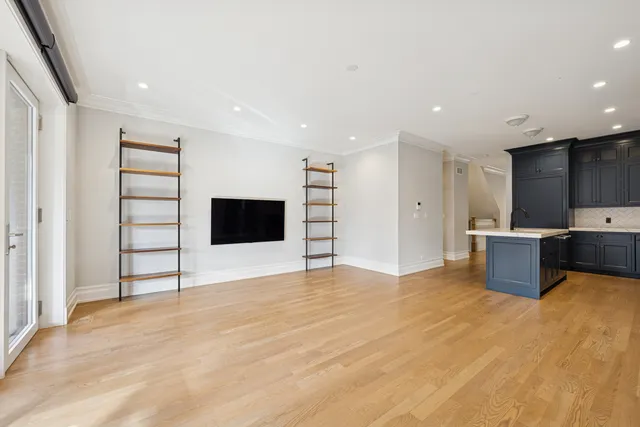 a view of a room with a sink and a large window
