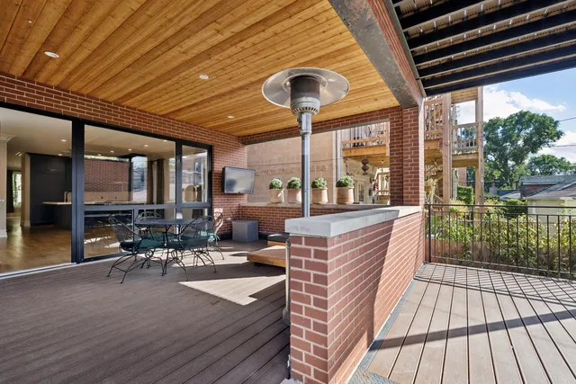 a living room with patio furniture and a patio