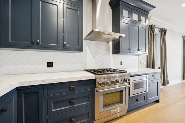 a kitchen with granite countertop a stove and a sink