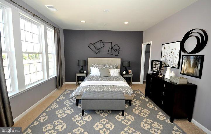 42590 Sunset Ridge Square Ashburn, VA 20148 - Photo 7 of 13 a bedroom with a bed and wooden floor