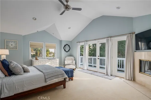 a bedroom with a large bed and a large window