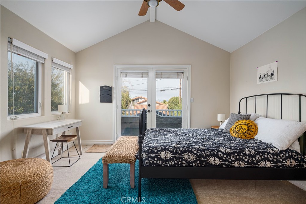 1534 3rd Street Manhattan Beach, CA 90266 - Photo 16 of 21 a bedroom with a bed and large windows