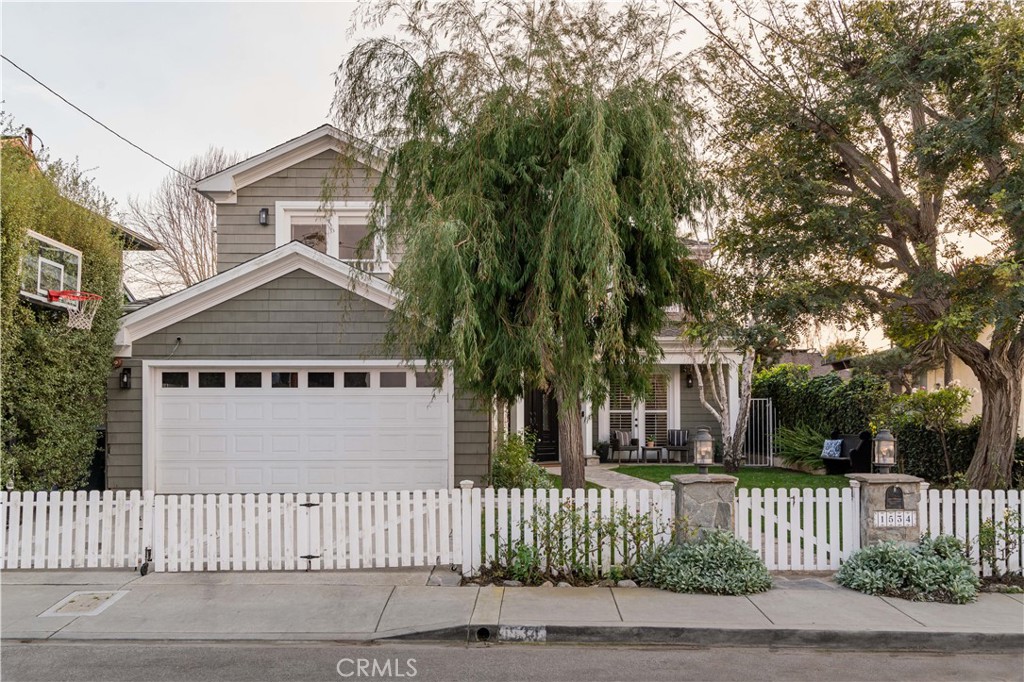 1534 3rd Street Manhattan Beach, CA 90266 - Photo 2 of 21 a front view of a house with a garden