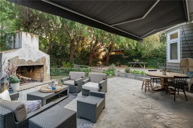 a backyard of a house with outdoor seating