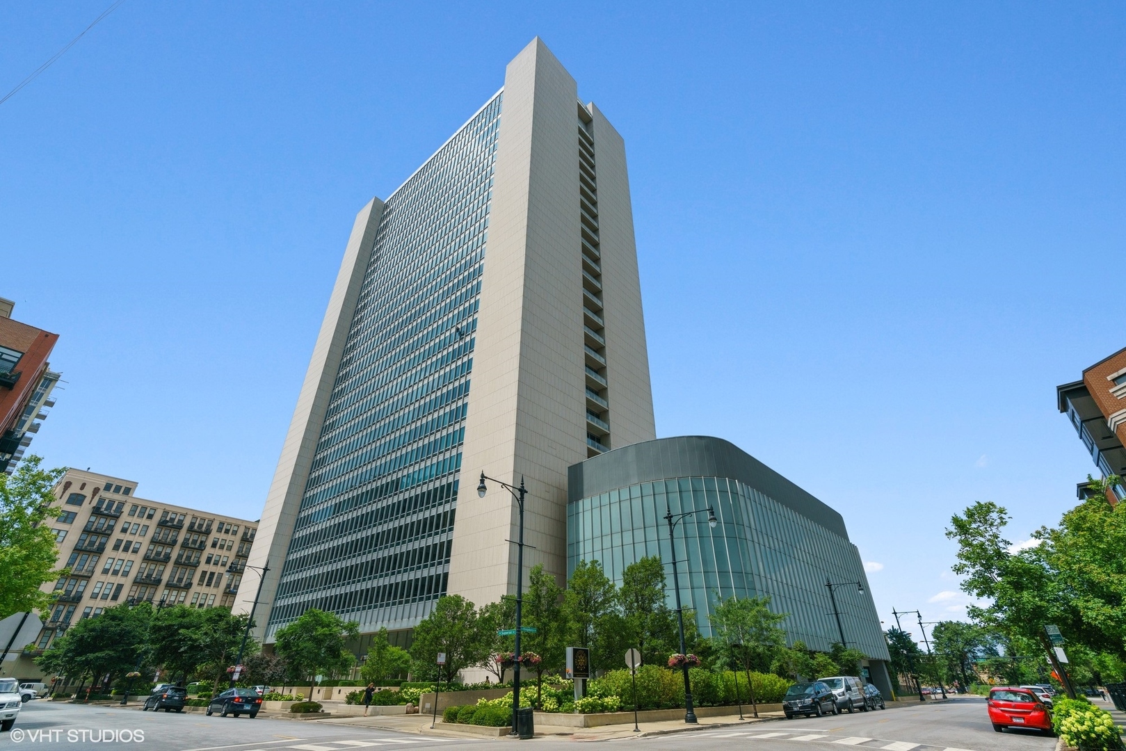 a view of a tall building next to a road