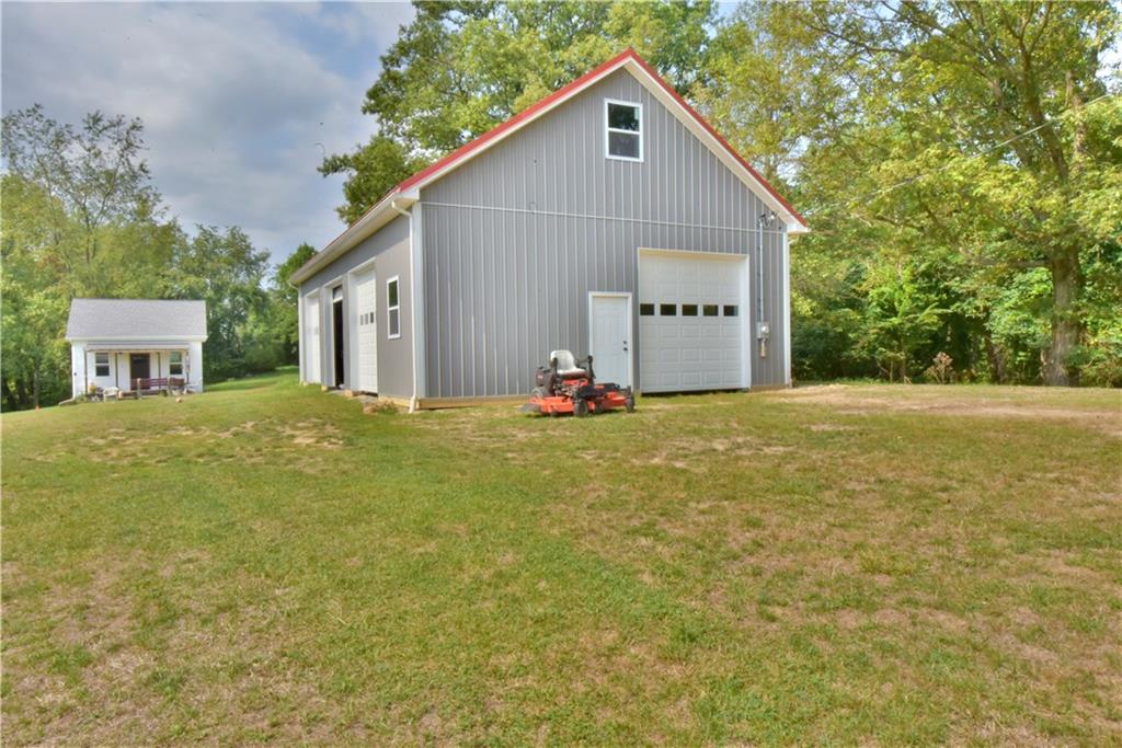 410 Robb Ridge Road Prosperity, PA 15329 - Photo 3 of 25 50x30 Garage with 5 Bay Doors 10x10 Tons of Storage above the garage.