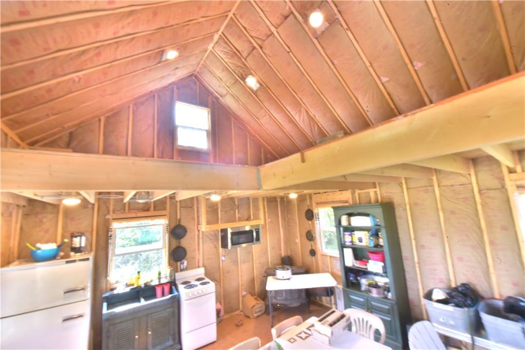 410 Robb Ridge Road Prosperity, PA 15329 - Photo 6 of 25 Inside the Cabin with Electric Stove and Fridge LOFT Plenty of room to bunk