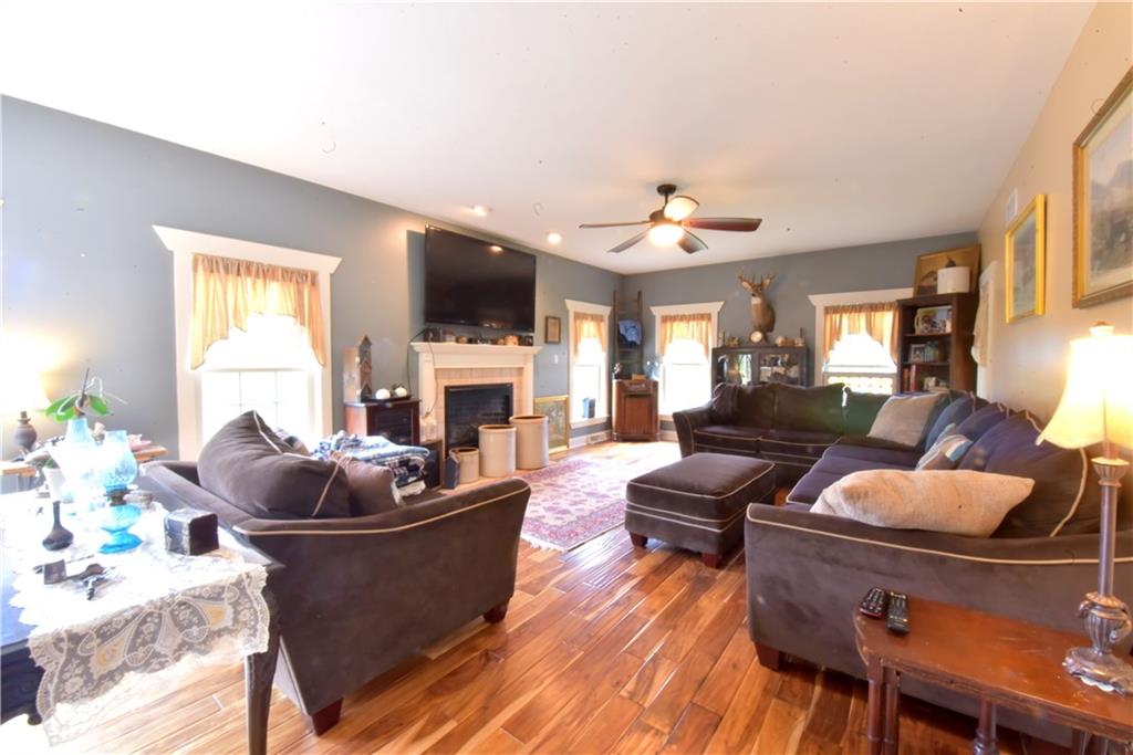 410 Robb Ridge Road Prosperity, PA 15329 - Photo 8 of 25 Massive Living Room 23x16 Fireplace/ Hardwood Floors A Ton of natural light..