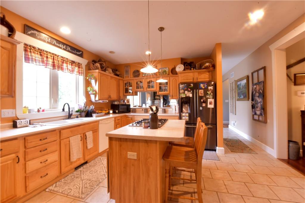 410 Robb Ridge Road Prosperity, PA 15329 - Photo 9 of 25 Kitchen 19x15 Plenty of counter and storage space. Tile floor, Appliances Stay! Opens into the Dining room and Living room