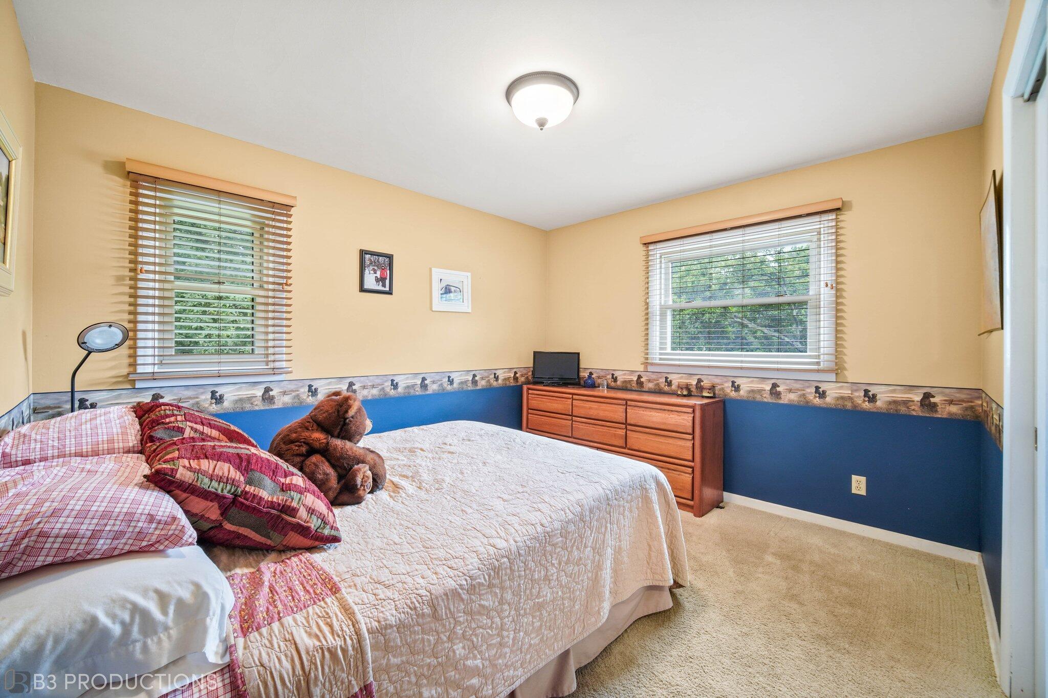 55 Deep River Drive Hobart, IN 46342 - Photo 13 of 21 a bedroom with a bed and a window