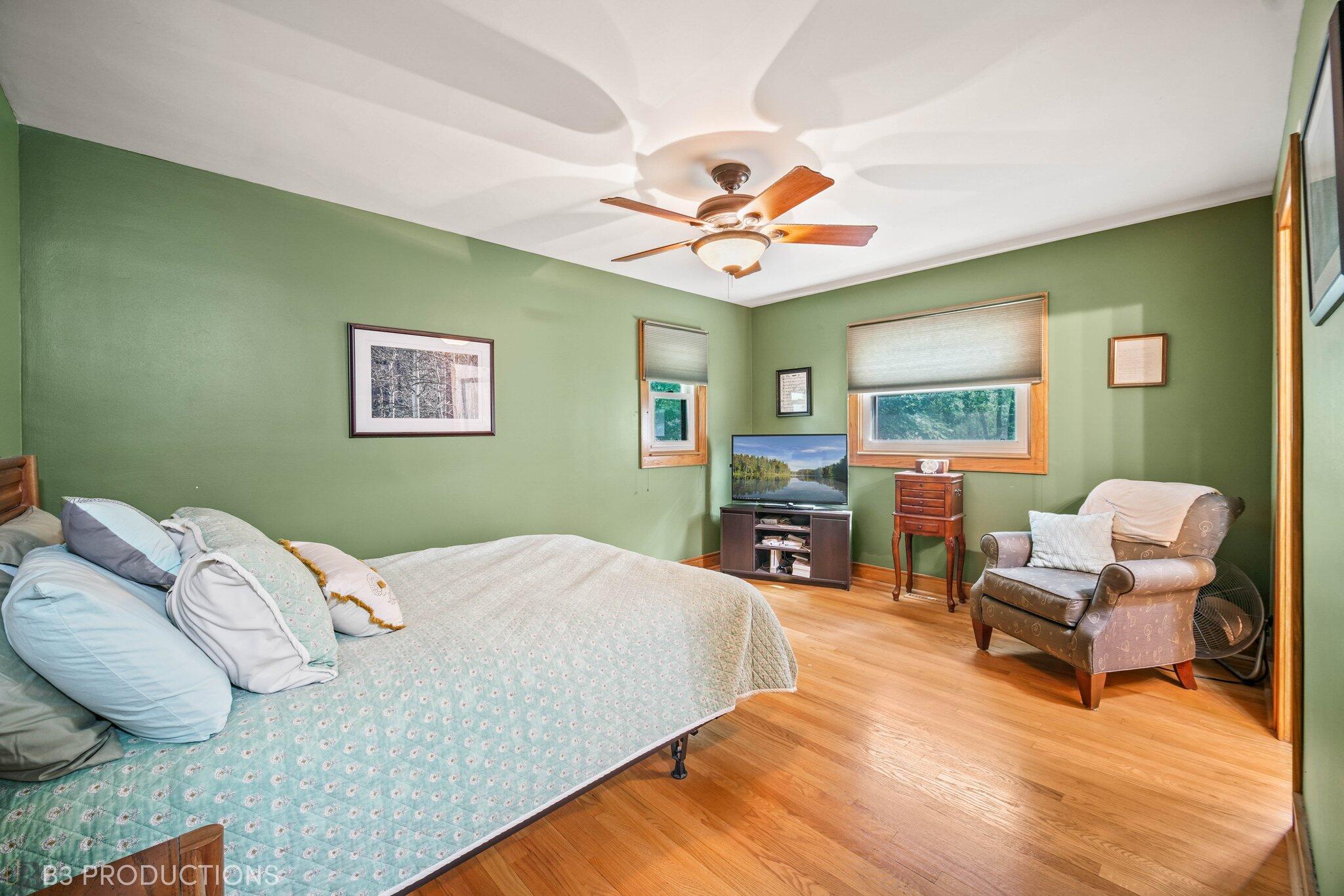 55 Deep River Drive Hobart, IN 46342 - Photo 14 of 21 a bedroom with a bed and a chair