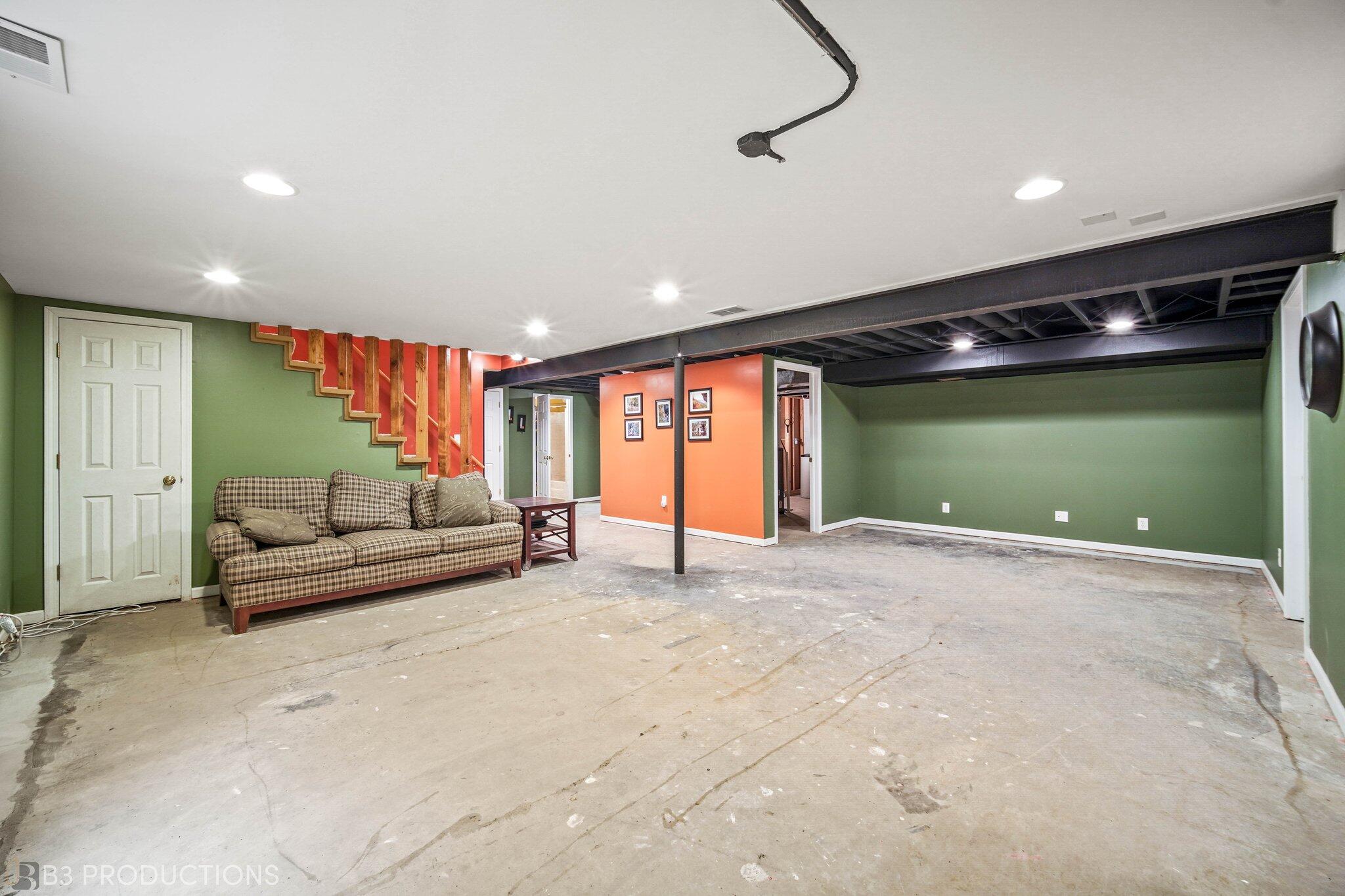 55 Deep River Drive Hobart, IN 46342 - Photo 21 of 21 a living room with furniture and a flat screen tv