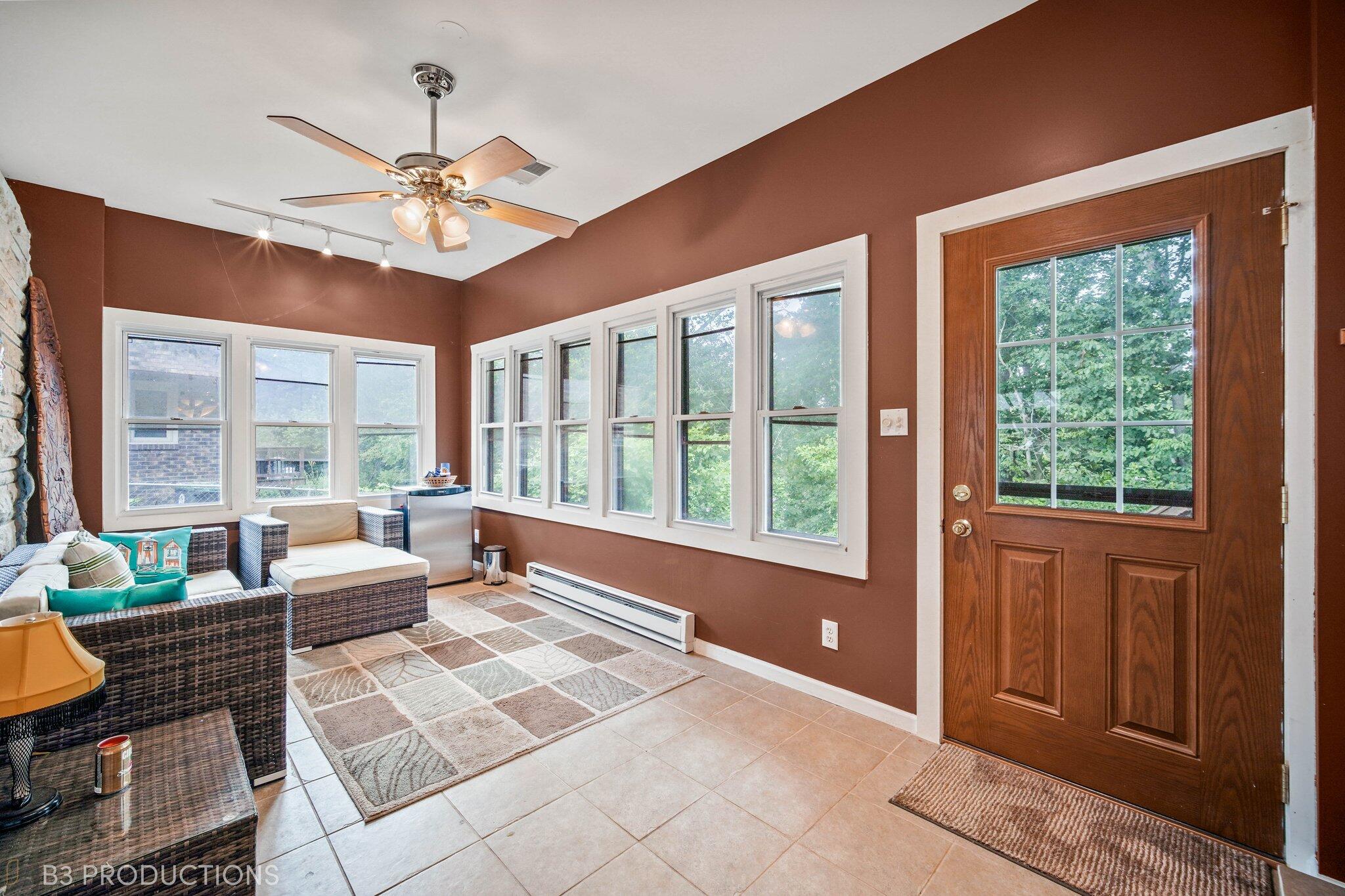 55 Deep River Drive Hobart, IN 46342 - Photo 3 of 21 a living room with furniture and floor to ceiling windows